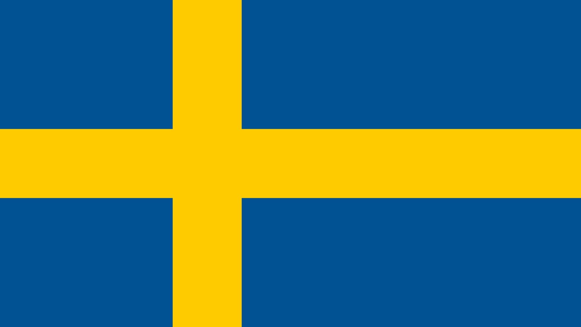 Bandeira da Suécia. Ela possui duas cores: azul e amarelo. O azul cobre toda a parte de trás da bandeira, já o amarelo preenche a cruz nórdica, que representa o cristianismo.