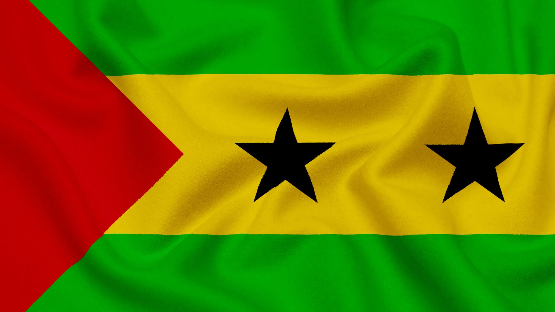 A bandeira é composta por três cores: vermelho, amarelo e verde. O triângulo vermelho simboliza a luta pela independência e as duas estrelas negras representam as duas principais ilhas do país, a de São Tomé e a de Príncipe.