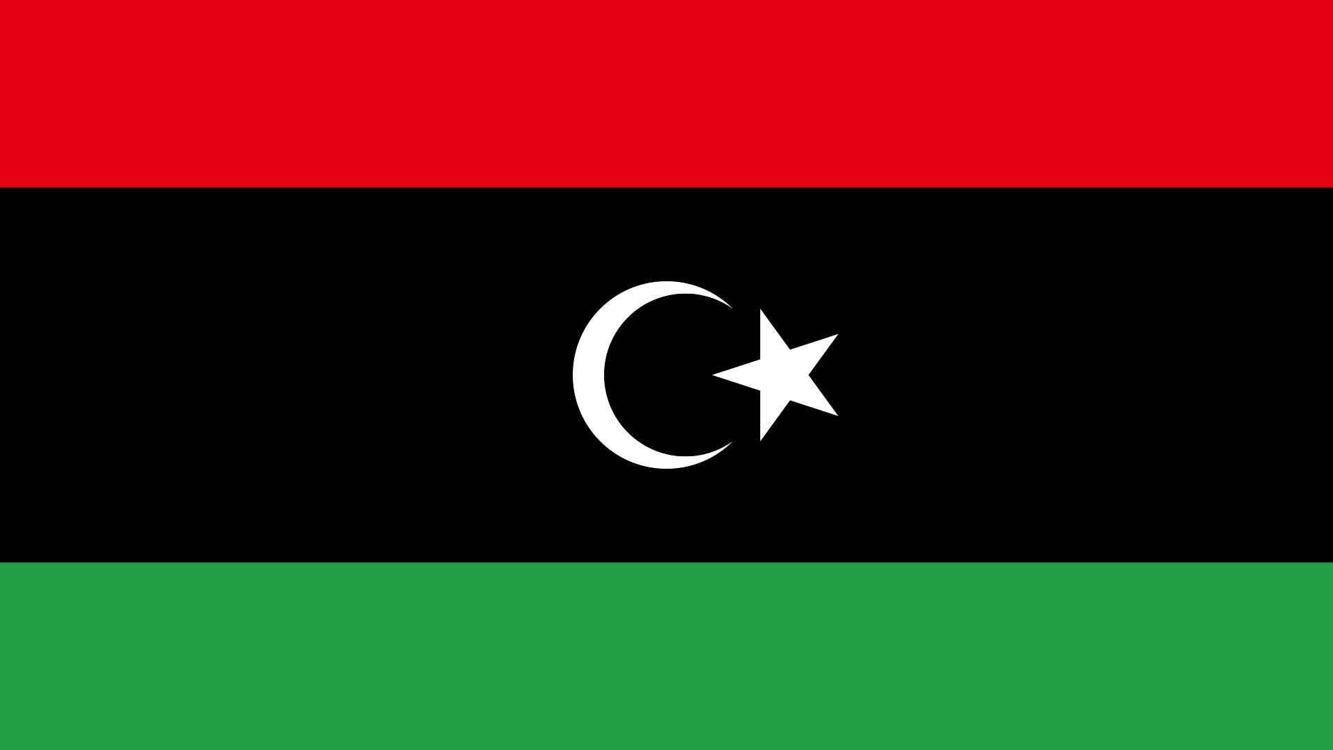 Bandeira com três faixas horizontais, sendo vermelha na parte superior, preta a central e verde a inferior.​ No centro da faixa preta aparecem uma lua crescente e uma estrela de cinco pontas, ambas de cor branca.