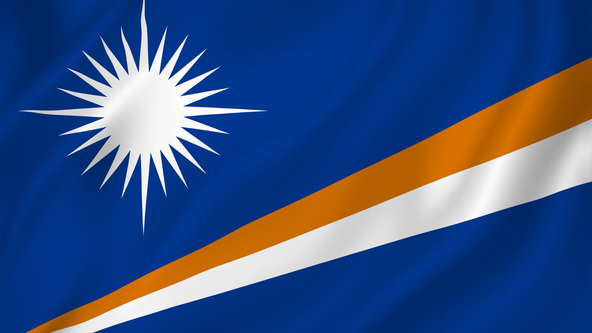 A bandeira das Ilhas Marshall  é composta pelas cores azul, branco e laranja. A cor branca representa o Sol nascendo. Este é o apelido da cadeia Ratak. Também é pelo país ser pacífico. Já a cor laranja, representa o raio de Sol.