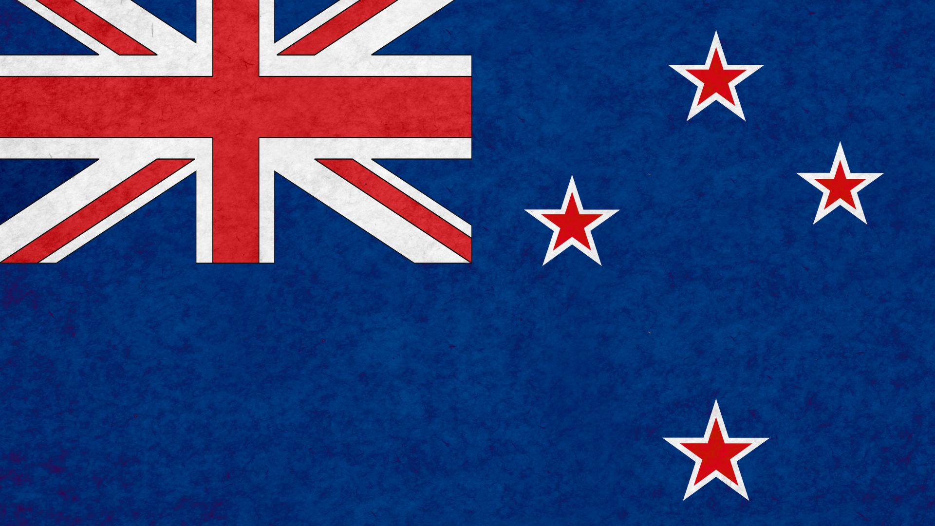 A bandeira da Nova Zelândia é azul marinho, e tem no seu lado superior esquerdo a bandeira da União, com mais 4 estrelas à direita, que representam a constelação de Crux.