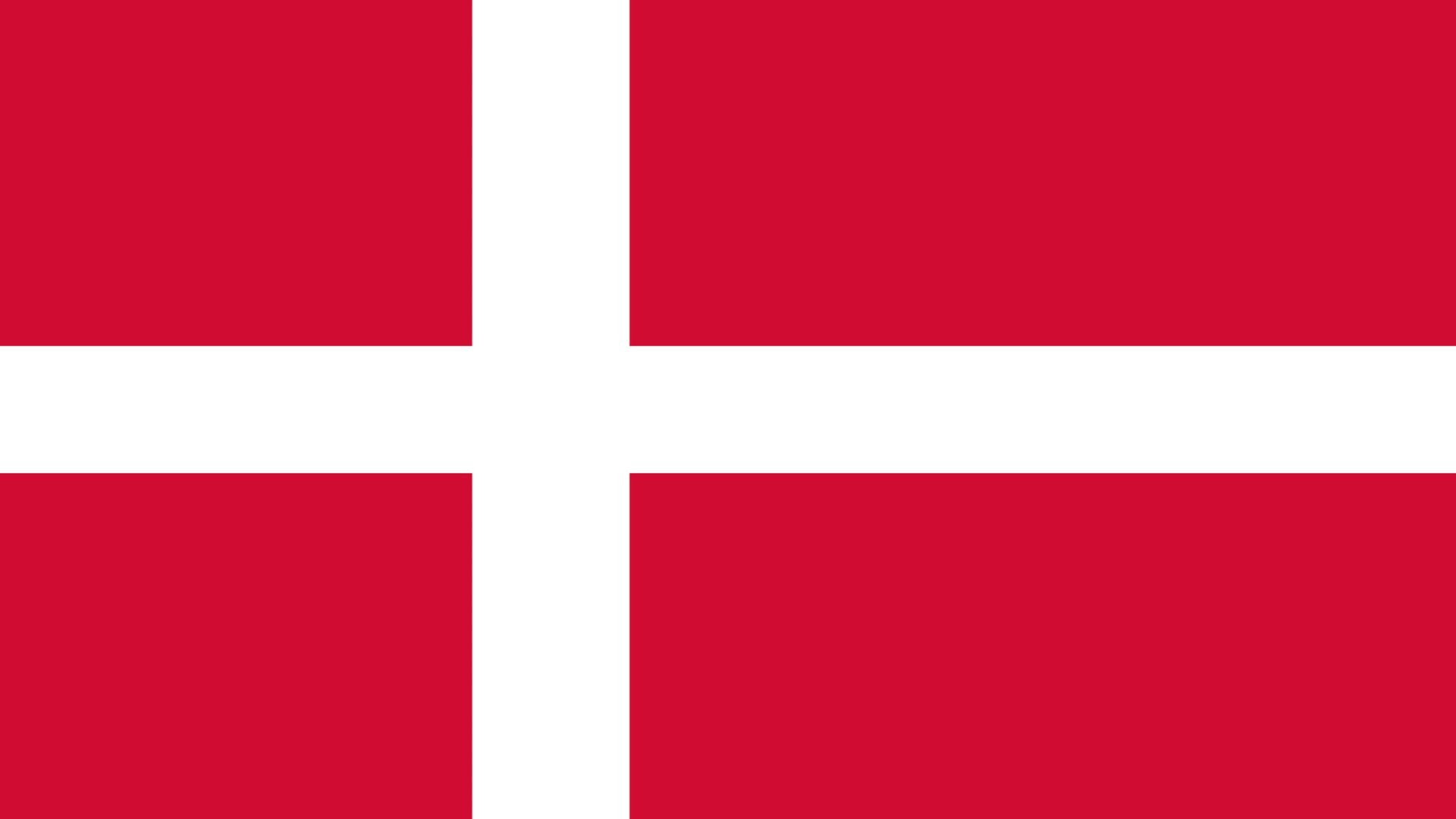 A bandeira da Dinamarca é vermelha e possui uma cruz, feita na cor branca e que se estende até as bordas da bandeira.