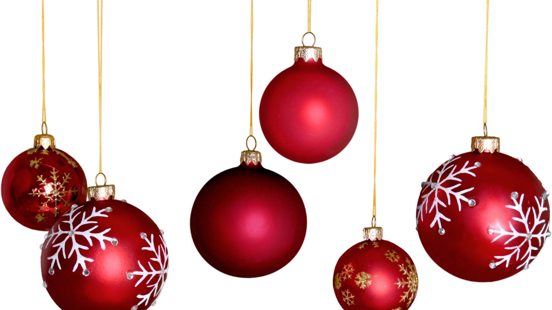Imagem de fundo branco, com destaque para as bolas de Natal na cor vermelha. Algumas são lisas e outras decoradas nas cores branco e dourado.