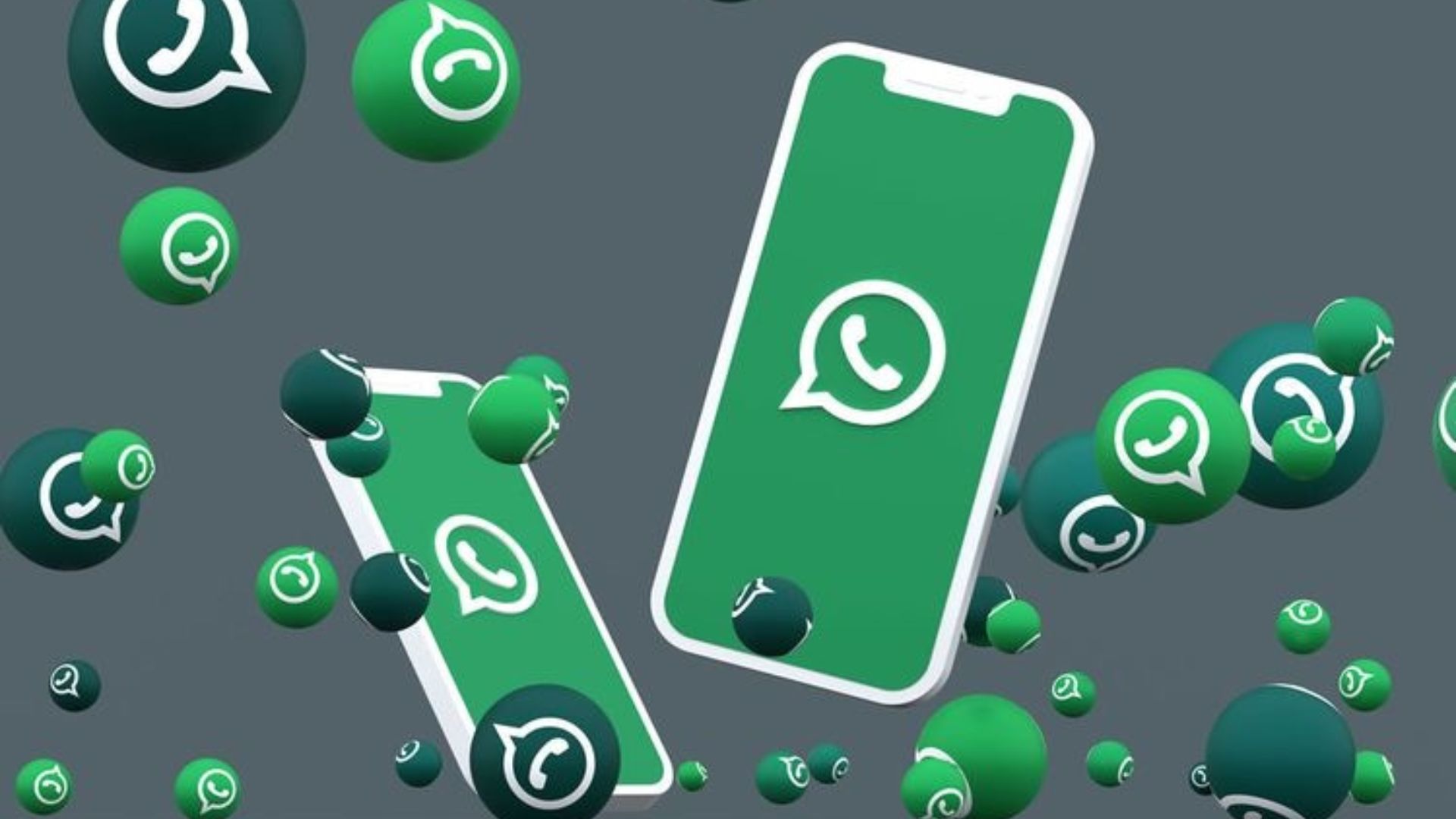 Imagem de fundo cinza com dois celulares que trazem em sua tela o logo do whatsapp. Ao redor deles, balões verdes com o logo do app.