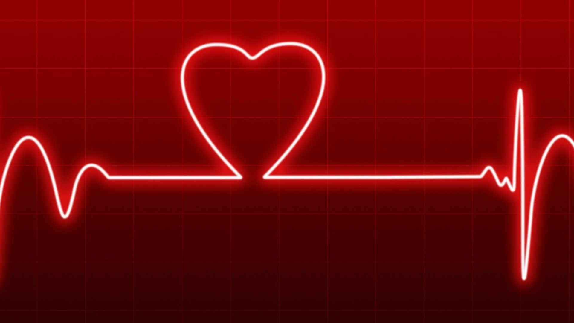 Imagem de um batimento cardíaco em formato de coração em um fundo vermelho