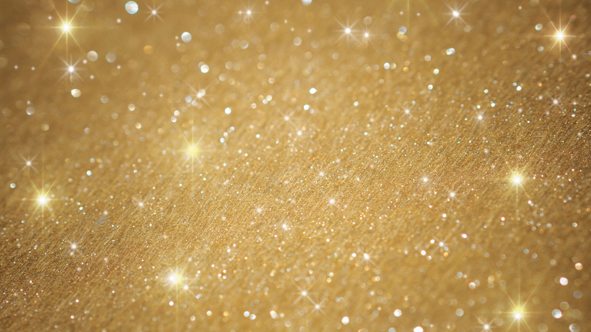 Imagem de fundo dourado brilhante, representando as luzes do Natal
