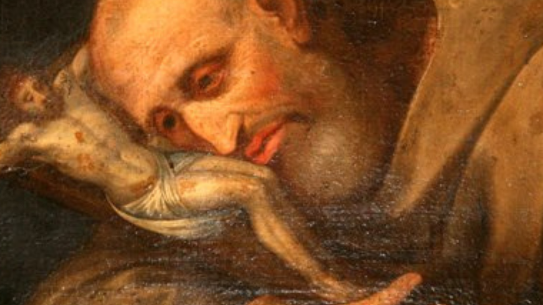 Pintura de São Bruno Abade com o rosto encostado na imagem de Jesus.