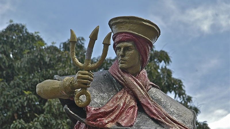 Wikipedia / Wikimedia Commons / Nevinho Escultura dourada de Exu