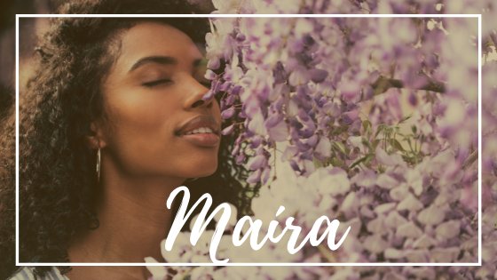 David-Prado / Getty Images Pro / Canva / Mensagens com amor Mulher negra cheirando flores roxas. O nome Maíra está em evidência